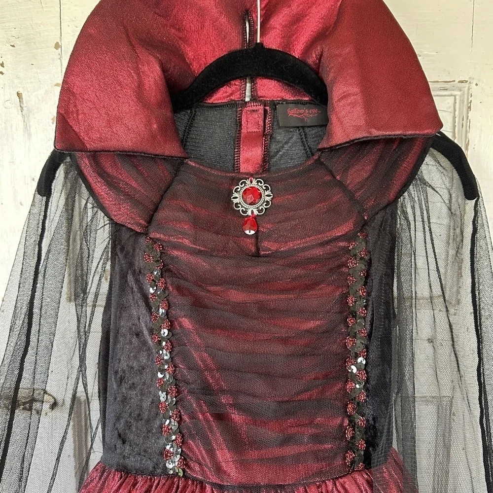 HALLOW’S EVE, GIRLS WITCH COSTUME.LONG DRESS WITH HOOP,IN RED/BLACK.SIZE S(7-8)